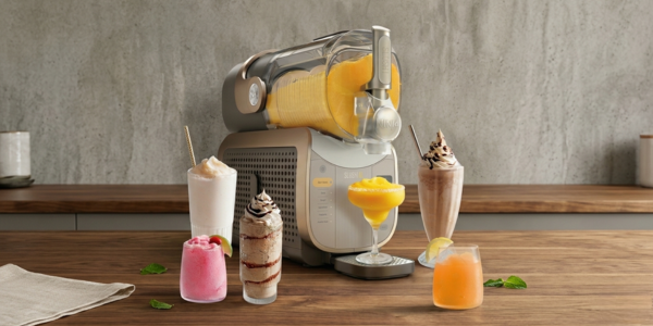 Ninja SLUSHi XL on a kitchen counter next to summer drinks