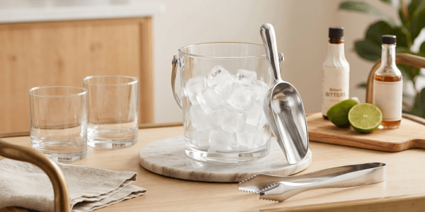 ice scoop and tongs set styled together for a home bar