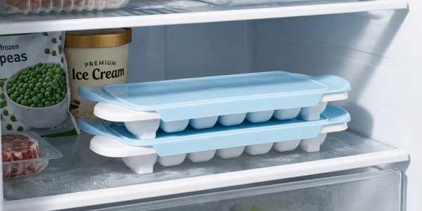 OXO Good Grips Ice Cube Tray 2 Pack White stacked in freezer with lid