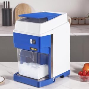 Alt text: Blue and white VEVOR electric ice shaver machine on a marble countertop with fresh crushed ice in the collection tray