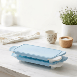 OXO Good Grips Ice Cube Tray 2 Pack White stacked in freezer with lid